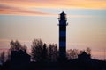 Silhouette Lighthouse with sunset in the background Royalty Free Stock Photo