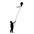 Silhouette little boy flying kite. Royalty Free Stock Photo