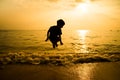 Silhouette of little boy jumping over Royalty Free Stock Photo