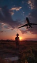 Silhouette of a little boy standing in the field at sun dusk. Kid looking at the plane that has just taken off. Generative AI Royalty Free Stock Photo