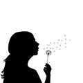 Silhouette of a little girl blowing dandelion Royalty Free Stock Photo
