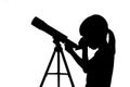 Silhouette of little girl looking through a telescope