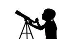 Silhouette of little girl looking through a telescope Royalty Free Stock Photo