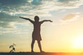 Silhouette of little girl raising hand to happy time Royalty Free Stock Photo