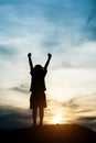 Silhouette of little girl raising hand happy time Royalty Free Stock Photo