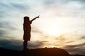 Silhouette of little girl raising hand happy time Royalty Free Stock Photo