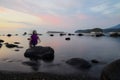 Silhouette of a little girl having fun in Utoro beach during dusk in eastern Hokkaido, Japan. Royalty Free Stock Photo