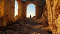 Person Walks Through Archway in Ancient Matera During Sunrise Royalty Free Stock Photo