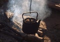 Kettle over an extinct fire Royalty Free Stock Photo