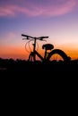 Silhouette a lonely bike sunset. Royalty Free Stock Photo