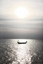 Lonely boat silhouette at Andaman blue sea in calm weather, Thailand Royalty Free Stock Photo