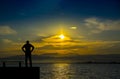 Silhouette,lonely man watching the sea at sunset Royalty Free Stock Photo