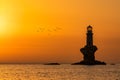 Silhouette of the lonely Tourlitis light house during sunrise