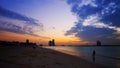 Silhouette of a lonely woman at the beach in the gorgeous sunset Royalty Free Stock Photo