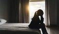 Silhouette of Lonely young woman feeling depressed and stressed