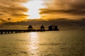 Silhouette The long bridge over the sea with a beautiful sunrise Royalty Free Stock Photo