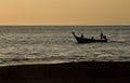 Silhouette of Long tail boat in Railay Beach Thailand at sunset