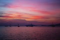 Silhouette Longtail boat with coastal fishing village,Beautiful Royalty Free Stock Photo