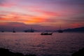 Silhouette Longtail boat with coastal fishing village,Beautiful Royalty Free Stock Photo