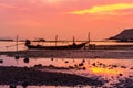 Silhouette longtail boat fishingboat moored on tropical beach  at fisherman village during sunset twilight  time Royalty Free Stock Photo