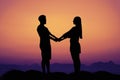 Silhouette of a love couple at sunset as symbol for wedding Royalty Free Stock Photo