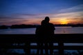 Silhouette of lovely couple on lake