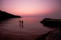 The silhouette of lover on the beach, sunset, twilight Royalty Free Stock Photo