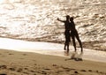 Silhouette of lovers on the beach Royalty Free Stock Photo