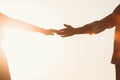 Silhouette of lovers hands stretching towards each other Royalty Free Stock Photo