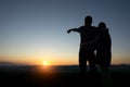 Silhouette lovers Hands up against sunset