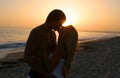 Silhouette Lovers Kissing on tne Beach