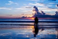 Silhouette lovers relax on the beach