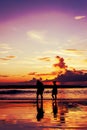 Silhouette lovers relax on the beach, Vintage tone