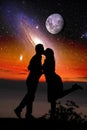 Silhouette of a loving couple against space landscape