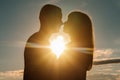 Silhouette of loving couple embracing at sunset Royalty Free Stock Photo