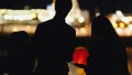 Silhouette loving couple at festival of floating Lanterns near river at night