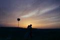 Silhouette of a loving couple kissing in the sunset Royalty Free Stock Photo