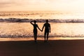 Silhouette of loving couple on sea. A couple in love at sunset. Man and woman meet sunset. Happy loving couple. Royalty Free Stock Photo
