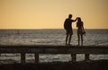 Silhouette Loving couple by the sea at sunset Royalty Free Stock Photo