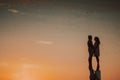 Silhouette of a loving couple at sunset near the sea Royalty Free Stock Photo