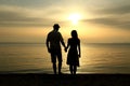 Silhouette of a  loving couple at sunset on the seashore Royalty Free Stock Photo