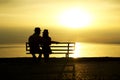 Silhouette of a loving couple at sunset on the seashore Royalty Free Stock Photo