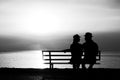 Silhouette of a loving couple at sunset on the seashore Royalty Free Stock Photo