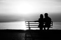 Silhouette of a loving couple at sunset on the seashore Royalty Free Stock Photo