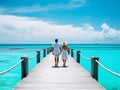 silhouette of loving couple walking on the pier at the seaside in turquoise color