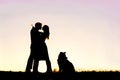 Silhouette of Loving Young Couple Hugging at Sunset Outside Royalty Free Stock Photo