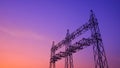 Silhouette of high voltage steel electric pylons of new power station in construction site on twilight sky Royalty Free Stock Photo