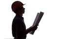 Silhouette of male construction engineer with building project, man in formal clothes and helmet control the work on white isolate