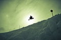 Silhouette of a male creating snowboard stunt