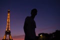 Silhouette of a male with Eiffel Tower background